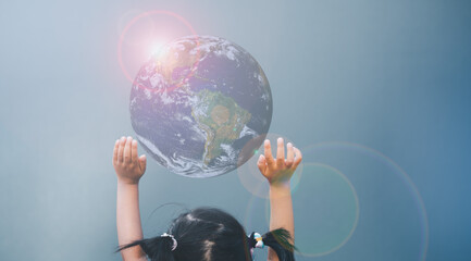 earth day,World harmony green peace environment , sustain ecology, climate change, save the world, helping hands, girl rise up hands to save the planet earth, elements of the image furnished by nasa