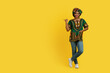 © Prostock-studio - Attractive african lady in colorful outwear pointing at copy space