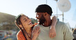 © Siphosethu F/peopleimages.com - Interracial couple, hug and bonding on city building rooftop for summer holiday, travel vacation date and location break in Boston. Smile, happy black man and talking woman or student fashion friends