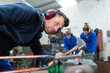 © auremar - master works with a hammer in the workshop