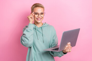 Wall Mural - Photo portrait of pretty young girl spectacles netbook apple macbook samsung wear trendy khaki look isolated on pink color background