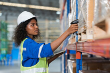 African American Female Warehouse Worker Scanning Barcodes On Boxes On Shelf Pallet In The Storage Warehouse. Woman Worker Working In The Warehouse
