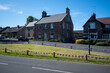 © Christopher Keeley - Bamburgh village green and cottages. Decorated with bunting during Platinum Jubilee celebrations, June 2022. Northumberland, UK