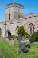 Wall Mural - The exterior of St Aidan's Church and churchyard in Bamburgh, Northumberland, UK