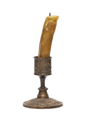 Wall Mural - Burning old candle vintage bronze candlestick. Isolated on a transparent background