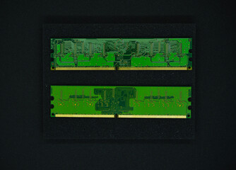 Wall Mural - Green RAM strips on black foam. Computer chips close-up. Microchips and memory chips.