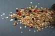 Baked fruit muesli scattered on the table. Homemade granola. Side view