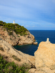 Wall Mural - Lighthouse Faro de Capdepera in spectacular natural landscape with wonderful views of steep cliffs in Mallorca, Cala Ratjada