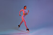 © Yaroslav Astakhov - Athletic active woman wearing sportswear jumping on studio background. Dynamic movement