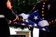 Marines folding American Flag at Funeral