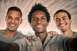 © T Mdlungu/peopleimages.com - Black man, friends and portrait smile for selfie, vlog or profile picture together for social media post. Happy men smiling for photo memories, picture moment or partnership in friendship happiness