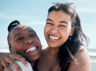 Poster - Woman, friends and hug with smile for beach day, summer vacation or travel together outdoors. Portrait of happy women laughing in joy for friendship, travel or fun holiday bonding by the ocean coast