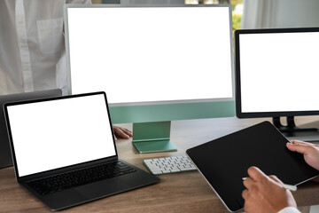 Poster - A businessman is working on a mock-up. Using a laptop with a blank copy space screen for your advertising text message computer