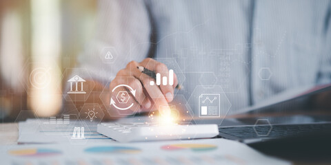 Fototapete - Accountant calculating numbers in company financial documents with calculator, Analysis of company financial data, Planning to assess and review the budget ,concept of finance and investment