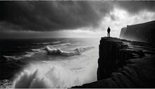 A Dramatic Black And White Photo Of A Solitary Figure Standing At The Edge Of A Windswept Cliff, With The Ocean Crashing Against The Rocks Far Below, Creating A Sense Of Solitude And Isolation.