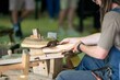 © William - buliding wooden boats by hand in hobart tasmania at the wooden boat festival. wood working by hand