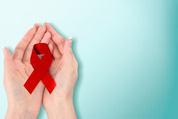 Sticker - Healthcare concept, hands with red ribbon