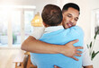 © Allistair F/peopleimages.com - Love, care and father and son with a hug for a visit, bonding and quality time. Happy, affection and dad hugging a man with an embrace after reunited, missing or showing appreciation in a home