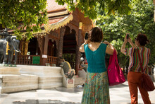 Tourists Photograph One Of Buildings At Wat Phra That Doi Suthep In Chiang Mai, Thailand