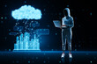 © Who is Danny - Hacker using laptop with glowing urban cloud and city communication hologram on blurry blue tech background. Smart city, hacking and IOT concept.