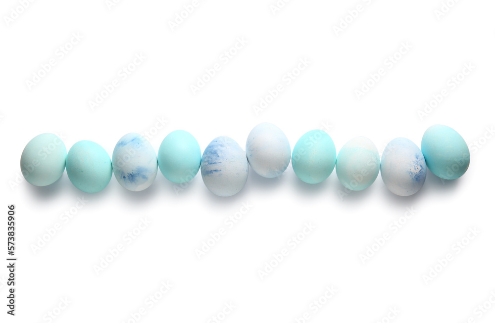 Row of painted Easter eggs on white background