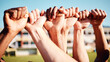 © Anela R/peopleimages.com - Fist hands, sport community and hand closeup of exercise team together on a outdoor field. Sports support, workout and fitness friends ready for a athlete competition with solidarity and teamwork