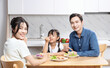 © Timeimage - Image of Asian family in the kitchen