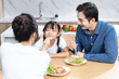 © Timeimage - Image of Asian family in the kitchen