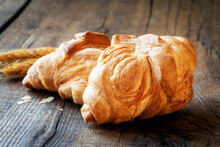 Italian Puff Bread Or Pane Schiocco Closeup On Dark Rustic Wooden Background