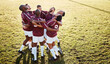 © Anela R/peopleimages.com - Fitness, field and group in a huddle with motivation, strategy and coordination after training. Sports, collaboration and team of male athletes in unity before a game or match by a grass stadium.