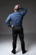 © Xalanx - Businessman full length from the back on gray
