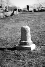 Blank Vintage Old Tombstone In A Graveyard In A Black And White Monochrome