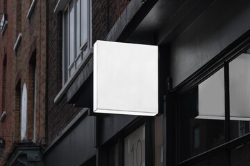 Blank square lightbox sign mockup in the urban environment, empty space to display your advertising or branding campaign