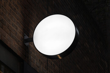 Blank circle shape lightbox sign mockup in the urban environment, empty space to display your advertising or branding campaign