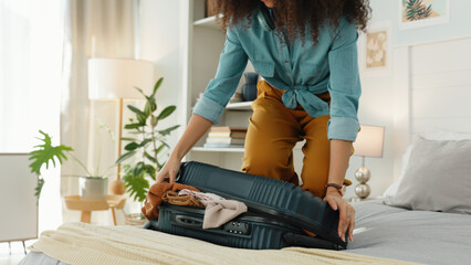 Sticker - Travel, vacation and black woman packing suitcase in bedroom for adventure destination. Woman in hotel, international journey and clothes in bag before airport trip and freedom to explore the world.