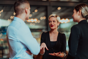 Photo of a business team of young people discussing business ideas in a modern urban environment. Selective focus 