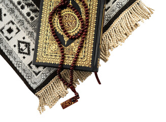 Holy Quran and prayer beads on it