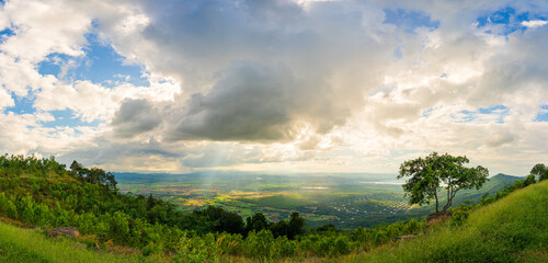 Wall Mural - mountain landscape with sunset on the cloudy sk