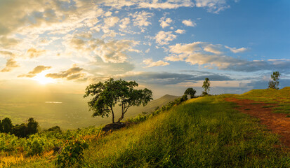 Wall Mural - mountain landscape with colorful vivid sunset on the cloudy sk