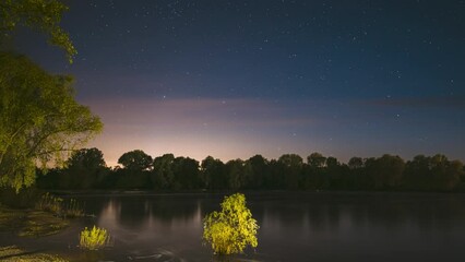 Wall Mural - Night Sky Above River. 4k Timelapse. Stars Float Across Sky. Dawn Is Coming. Night Sky Turns Into Morning. From Dusk To Dawn. Time Lapse. Time-lapse. Timelapse.