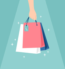 Hand holding glowing shopping bags unger light on a green background. Vector illustration in flat style