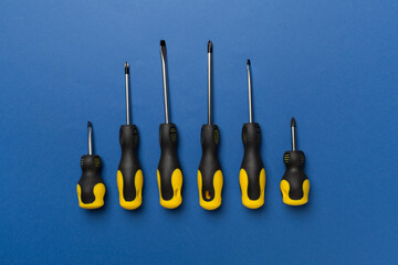 Sticker - Screwdrivers on color background, top view