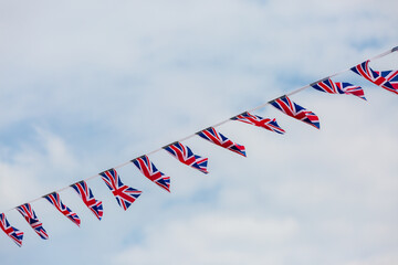 Looking up at Union Jack bunting against the sky