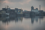 Fototapeta  - Panoramic view of the city of Kyiv and the Dnieper river in the evening, view of the old city and high-rise buildings in the background