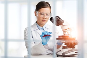 Poster - Young smart Scientist Working with microscope in The Lab