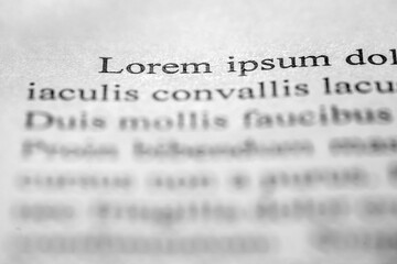 Poster - Lorem Ipsum on printed on paper, sample document beginning of paragraph of text, selective focus
