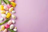 Fototapeta Kawa jest smaczna - Easter decorations concept. Top view photo of colorful easter eggs spring flowers yellow and pink tulips on isolated pastel violet background with empty space