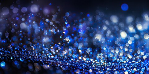 Sapphire glitter bokeh background. Unfocused shimmer royal blue sparkle. Crystal droplets wallpaper. Sequins.