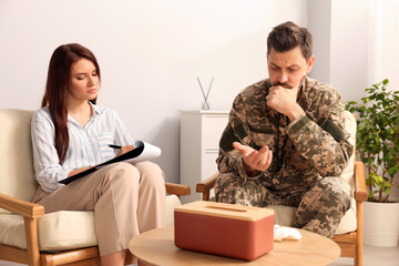 Wall Mural - Psychologist working with military officer in office