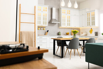 Sticker - Spring atmosphere. Stylish kitchen interior with comfortable furniture